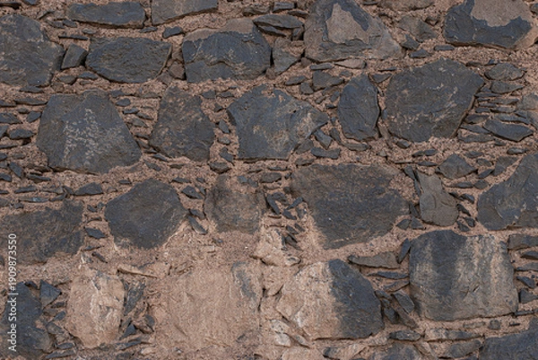 Obraz Ancient rustic volcanic stone wall texture background for design