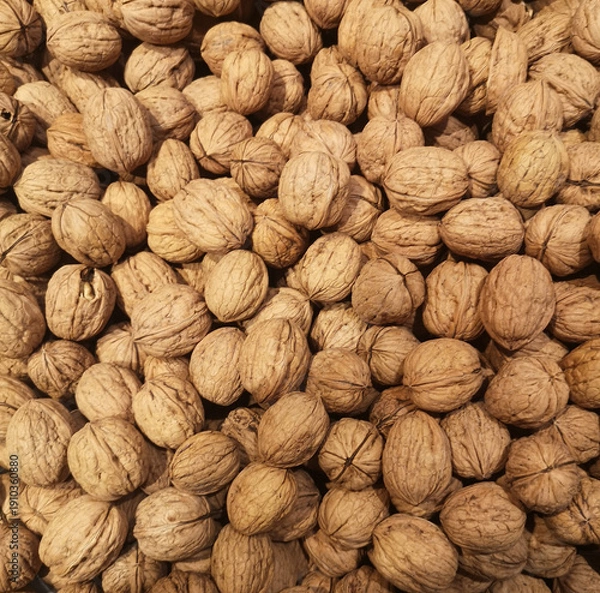 Obraz Walnuts in shells creating natural food background texture