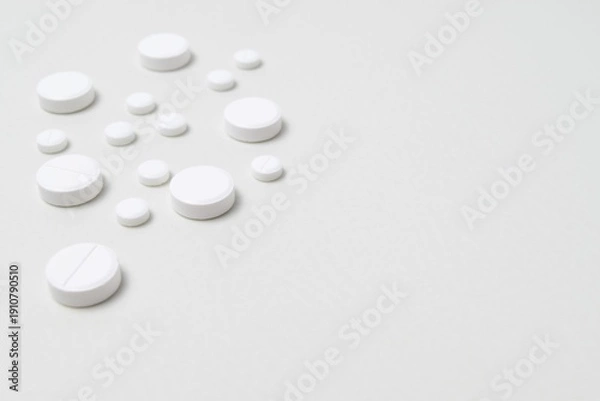 Obraz White pills on a white background