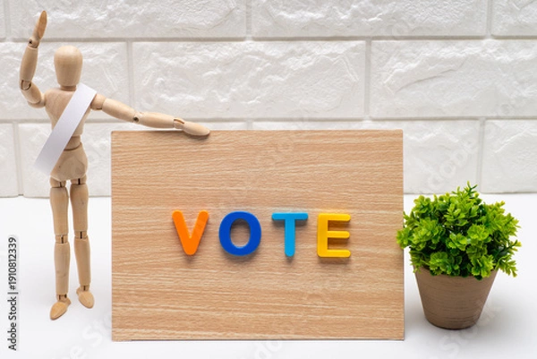 Obraz タスキを掛けた選挙の候補者と投票を促す看板