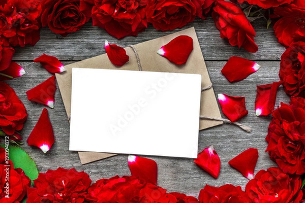 Fototapeta blank greeting card in frame made of red roses flowers and petals