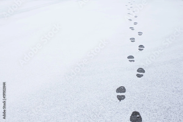 Obraz Winter foot steps in the snow on the ground