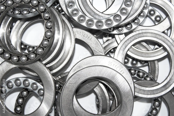 Obraz Industrial bearings and ball cages for rolls or wheels on white background