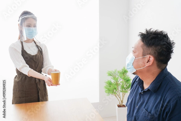 Obraz コロナウイルスの予防を徹底するカフェスタッフ