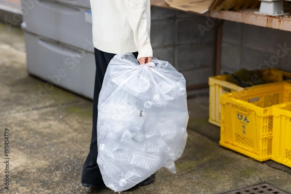 Obraz ゴミを出す女性