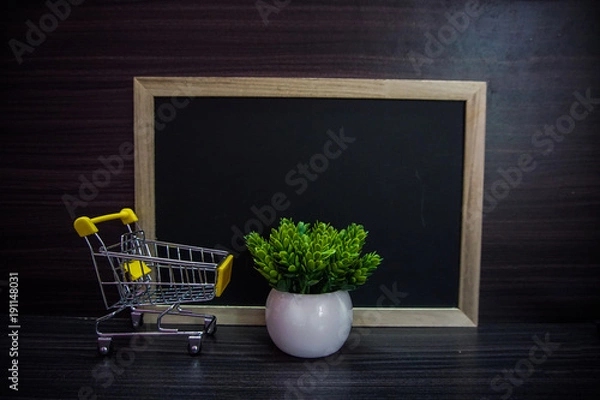 Fototapeta Red clock ,cute toy and Empty blackboard for copy space area