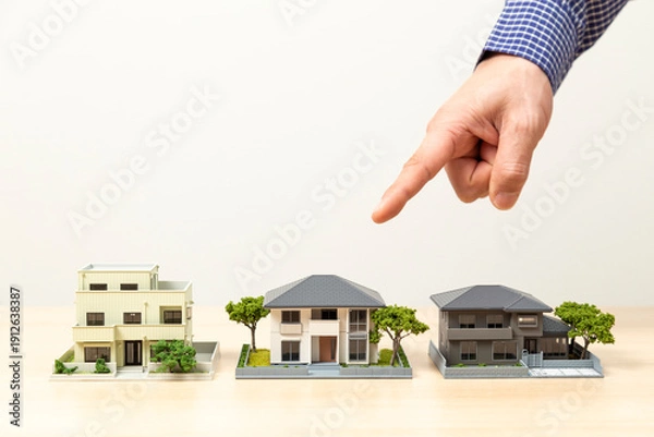 Obraz 住宅模型を指差す手元