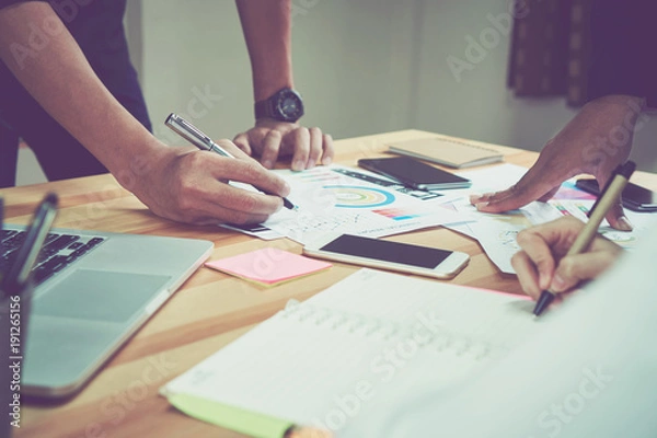 Fototapeta coworking space, team working together. Modern workplace desks and computers and documents, the device is ready for work.