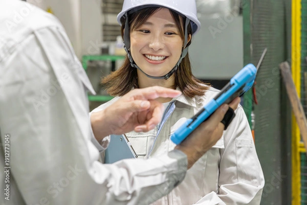 Obraz 工場で働く作業員グループ