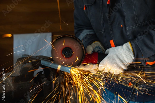 Obraz cutting a metal part with an angle grinder