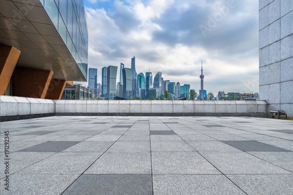 Fototapeta empty brick floor with cityscape and skyline.