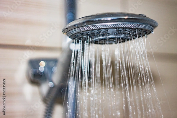 Obraz shower head with drops of water falling down