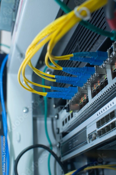 Fototapeta Ethernet Network Switch. Optical fiber cable.