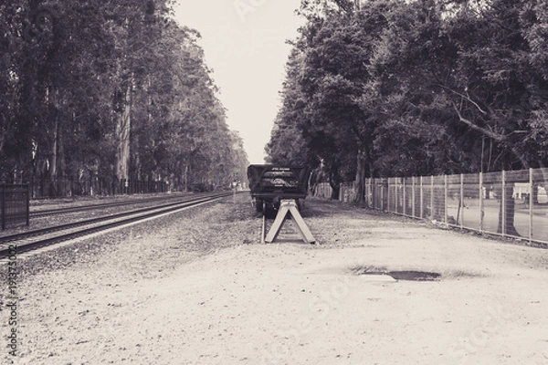 Obraz Railtracks with an abandoned boxcar