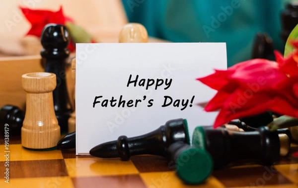 Fototapeta Bouquet of red tulips, chocolate hearts and chess with tag