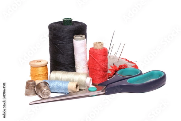 Obraz Scissors, needles and spools isolated over white.
