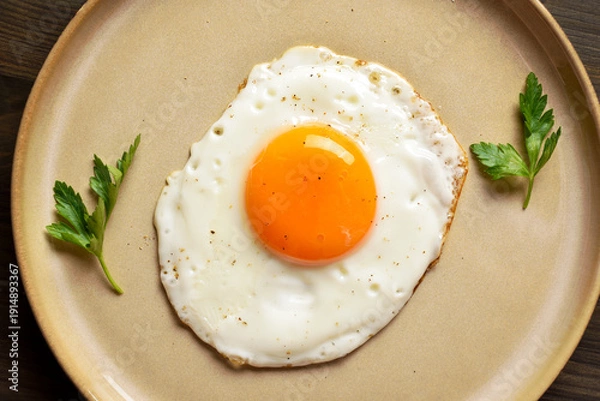 Fototapeta Fried egg on plate