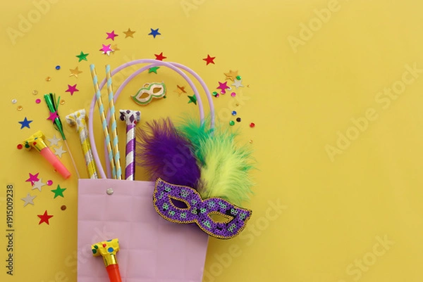 Obraz masquerade celebration concept over yellow background