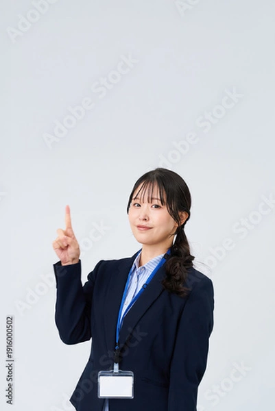 Obraz 指を立てるポーズをするビジネスウーマン