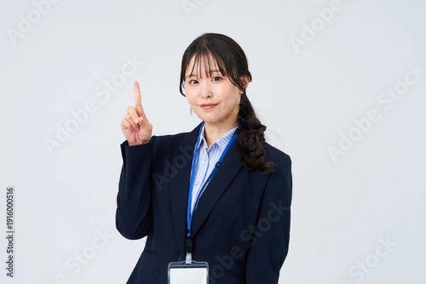 Obraz 指を立てるポーズをするビジネスウーマン