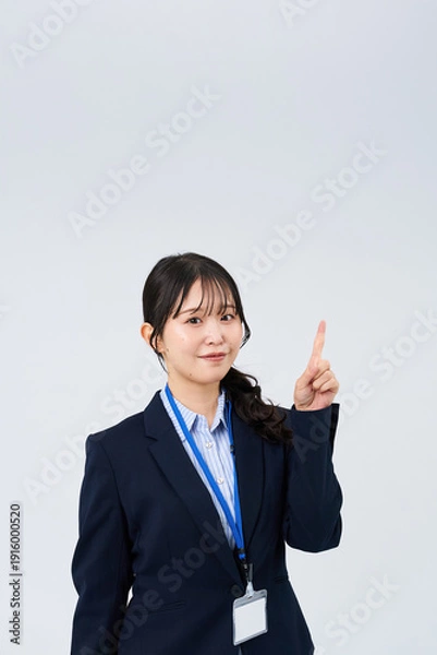 Obraz 指を立てるポーズをするビジネスウーマン