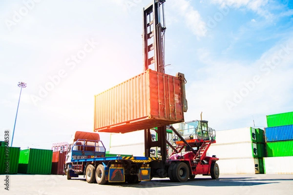 Fototapeta The forklift lifting container of transportation