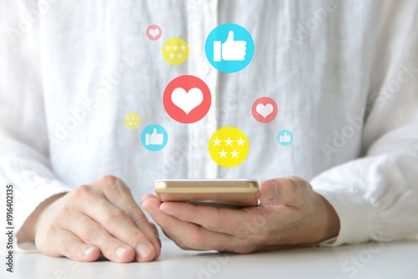 Fototapeta スマホのSNSや投稿に対して高評価を得ている人物のイメージ画像
