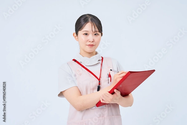 Obraz 白衣とエプロンを着た若い女性
