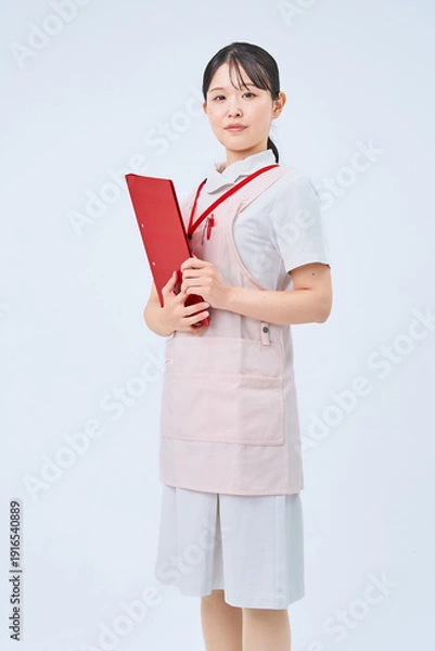 Obraz 白衣とエプロンを着た若い女性