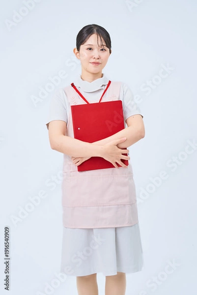 Obraz 白衣とエプロンを着た若い女性