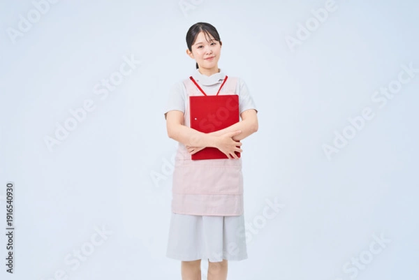 Obraz 白衣とエプロンを着た若い女性