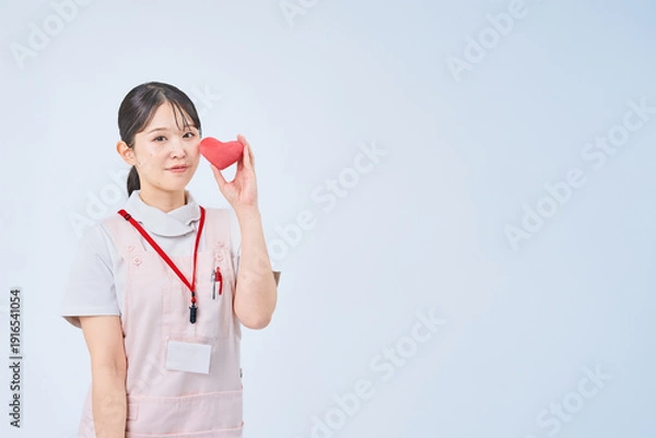 Obraz 白衣とエプロンを着た若い女性