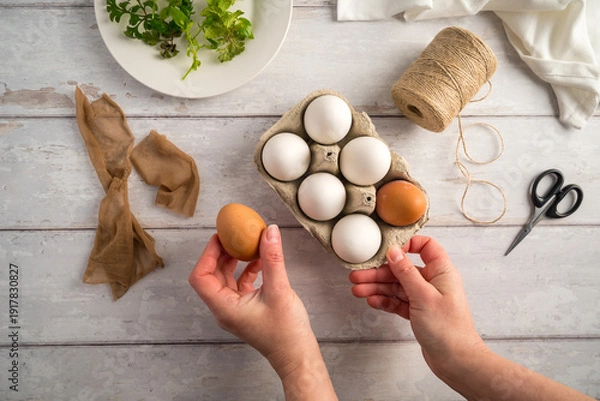 Obraz DIY Easter eggs with natural leaves, creating patterns on eggs using plants. Eco friendly colouring easter eggs