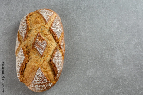 Obraz rustic sourdough bread on gray kitchen counter