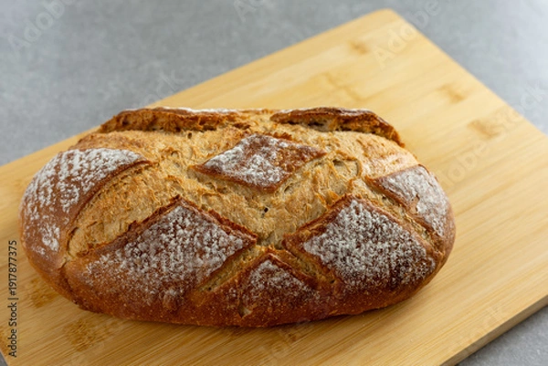 Obraz rustic sourdough bread on cutting board
