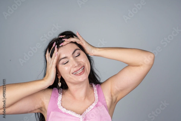 Obraz model holding her head with both hands