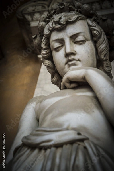 Fototapeta Worried angel immersed in a deep thought