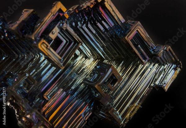 Fototapeta Shiny colorful mineral bismuth on a dark background