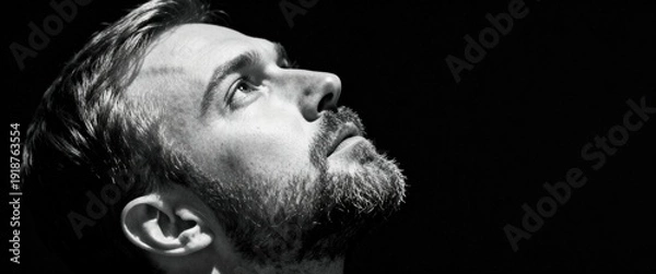 Obraz Man with Beard Looking Up in Contemplation