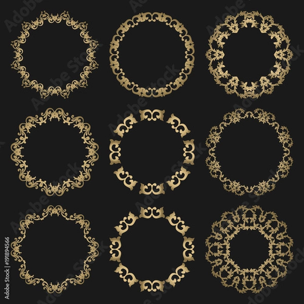 Fototapeta Set round openwork gold frames on black background.
