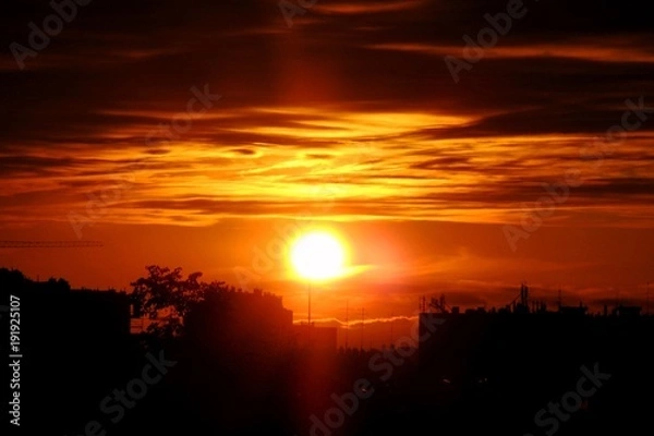 Obraz Orange sunset over city
