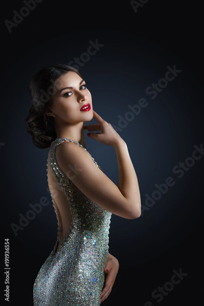 Obraz beauty fashion portrait of a beautiful model in an evening dress embroidered with stones. Girl on a black background. Shining stones and crystals.