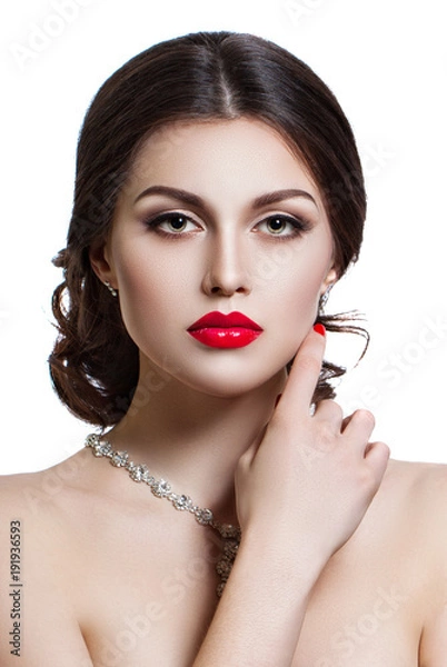 Obraz Portrait of a beautiful young woman with a professional make-up on a white background. The ideal beauty. Red lips.