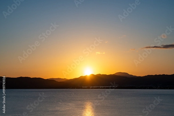 Obraz 天橋立に夕日が落ちる冬の風景