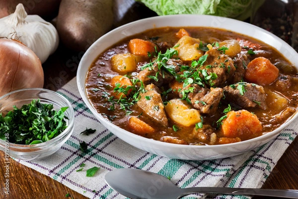 Fototapeta Irish stew made with beef, potatoes, carrots and herbs