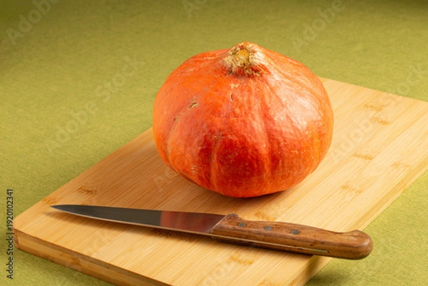 Obraz Orange pumpkin on a cutboard