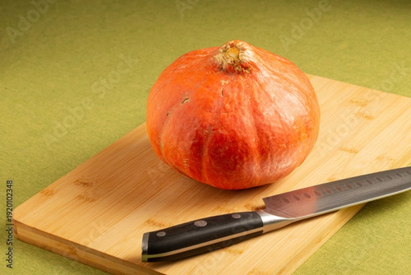 Obraz Orange pumpkin on a cutboard