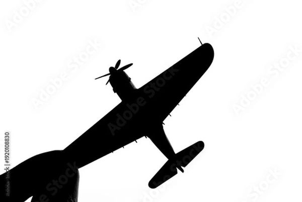 Obraz 指でつままれたシルエットのプロペラ戦闘機