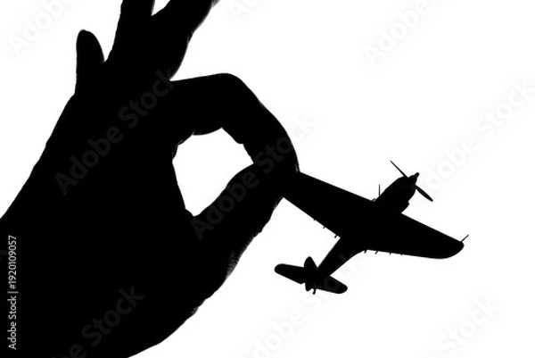 Obraz 指でつままれたシルエットのプロペラ戦闘機