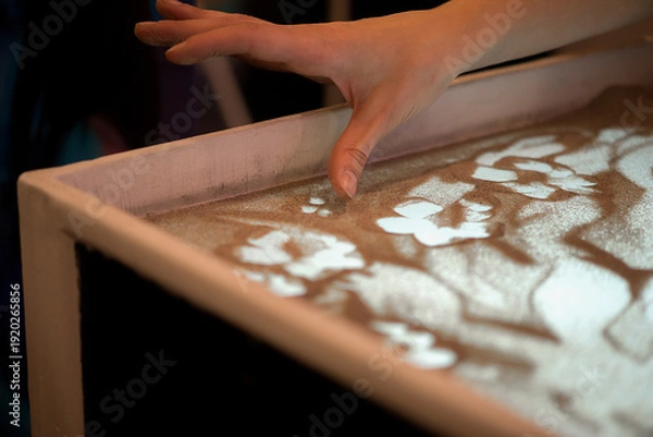 Obraz Creative Sand Art Table With Hand Drawing Soft Patterns In Warm Light Scene